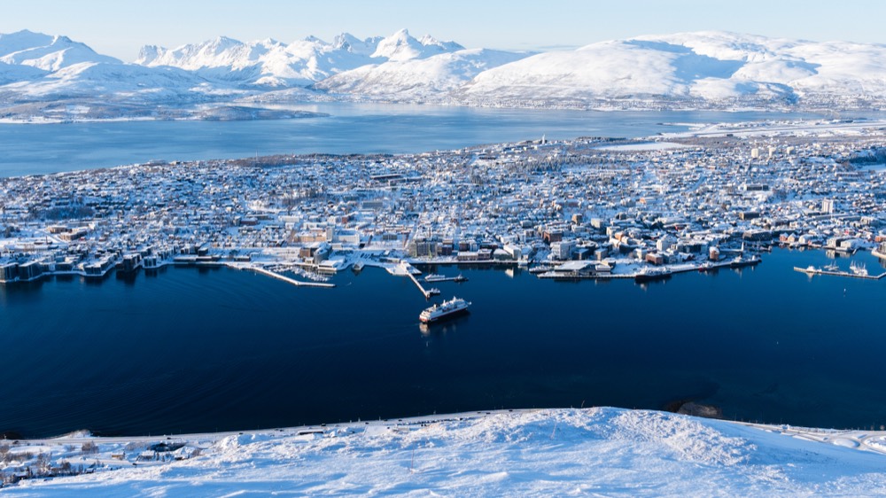 Snow-covered Tromsø between fjord and Arctic peaks